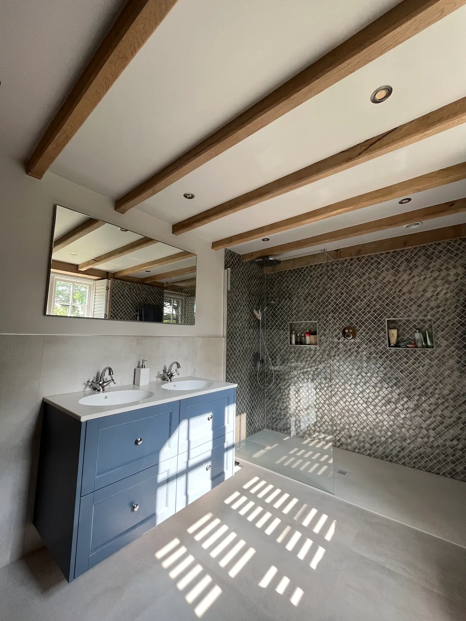 Modern fitted bathroom with walk-in shower